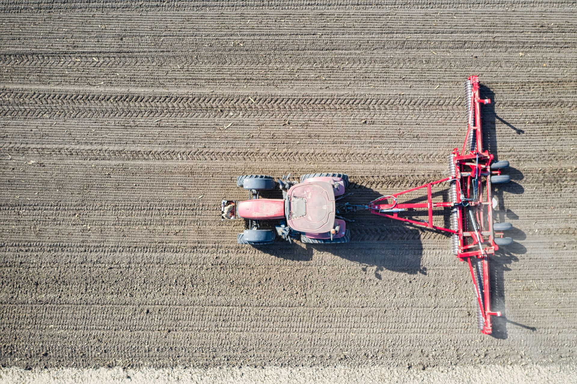 Aerial view of agricultural machinery preparing farmland